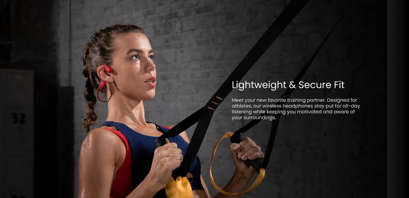 Person wearing bone conduction headphones during gym suspension training