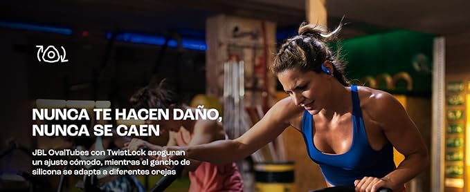 Ear hook headphones worn during gym workout — hook visible wrapping behind ear